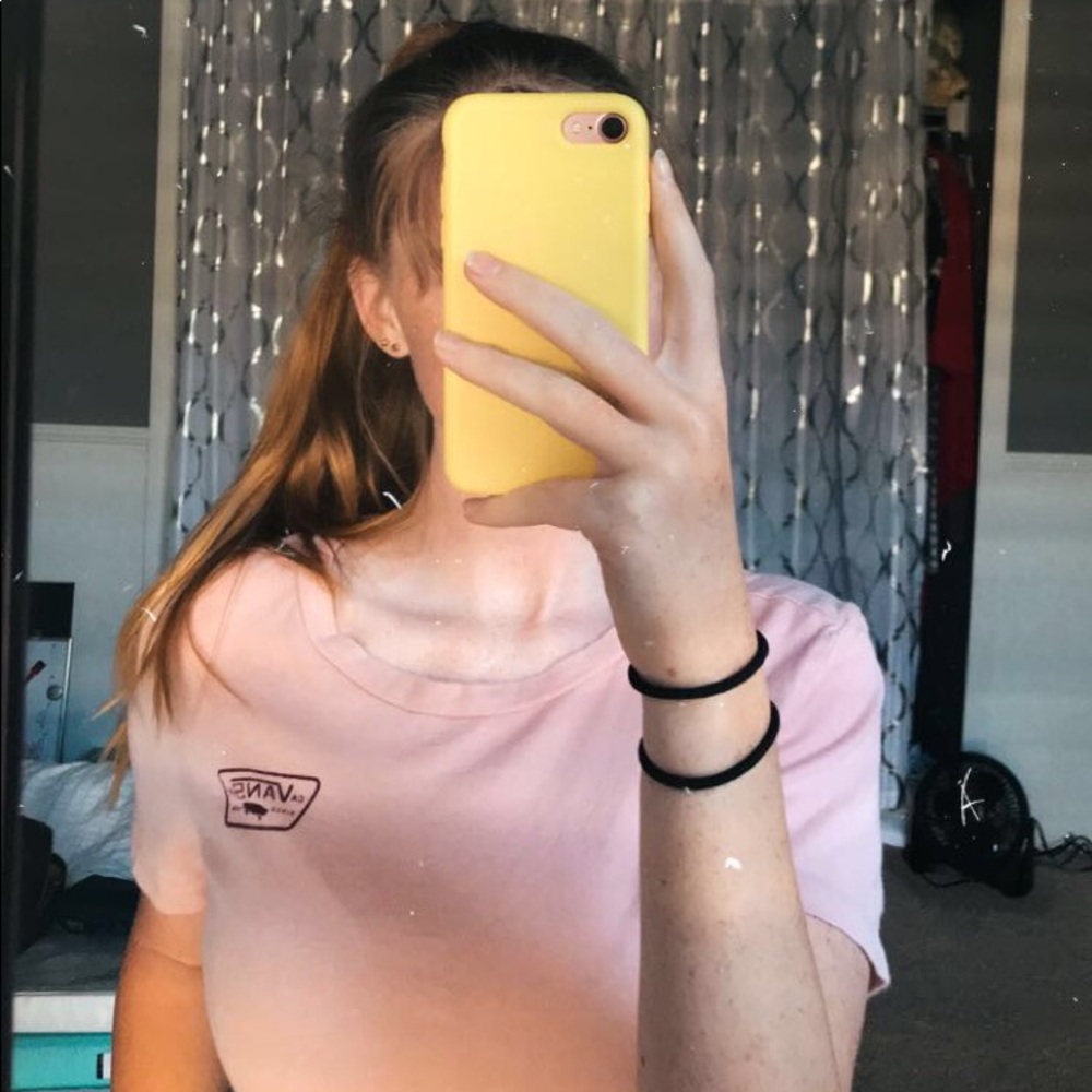 tan vans shirt with skateboard logo